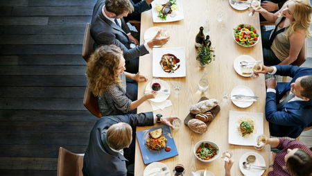 Overhead view of a group of business people eating lunch