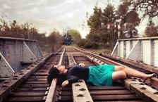 Worker lying on train track due to suicidal job