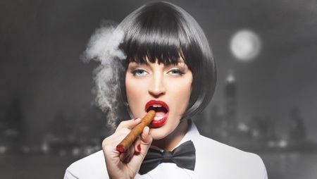 female manager smoking cigar