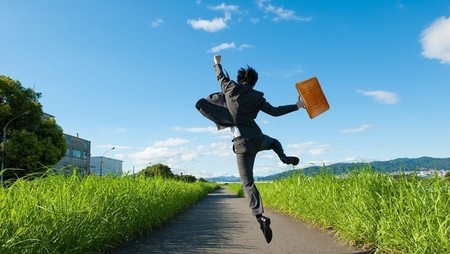 Businessman jumping in air