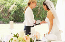 Wedding planner discussing plans with bride on wedding day