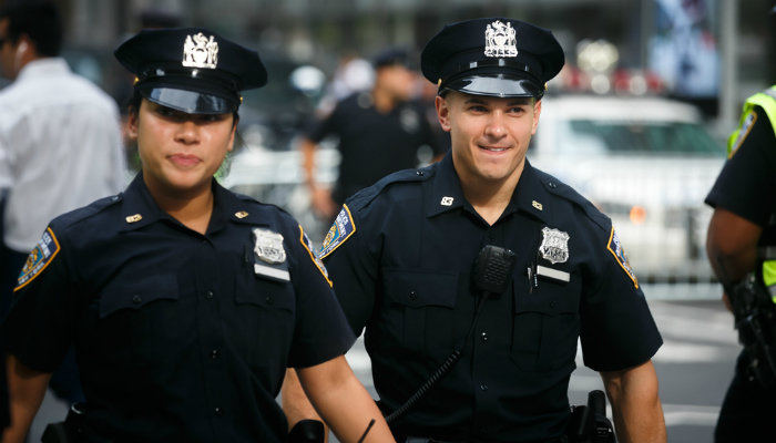 Two police officers performing their duties on the streets of New York City