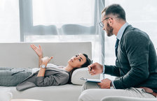 Male psychologist with female patient
