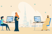 highly paid dubai office workers with a backdrop of the Dubai skyline, one woman is wearing a hijab while the other is in front of her desktop computer, there is also a man wearing a thawb, sitting in front of his computer 