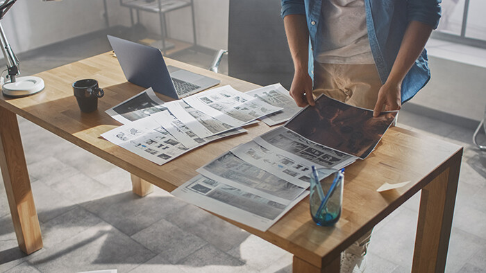 Storyboard artist putting together a board for a film