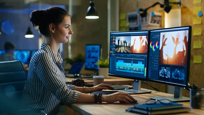 Visual effects artist altering images on a computer