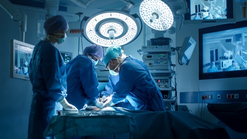 A group of surgeons in an operating room