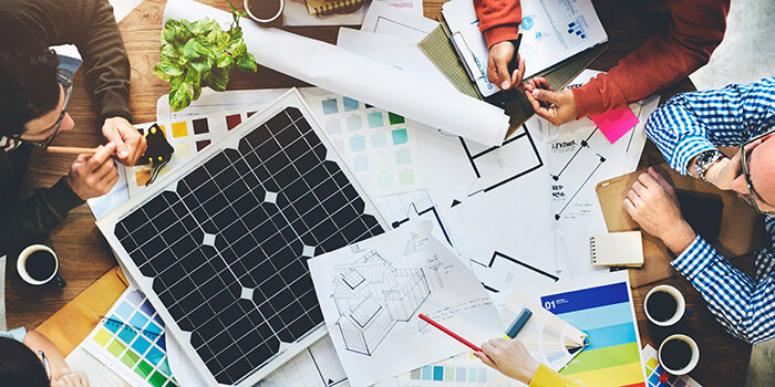 Solar energy system designers working on a project design