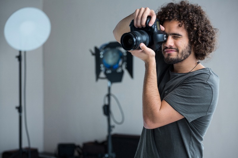 Photographer holding up a camera